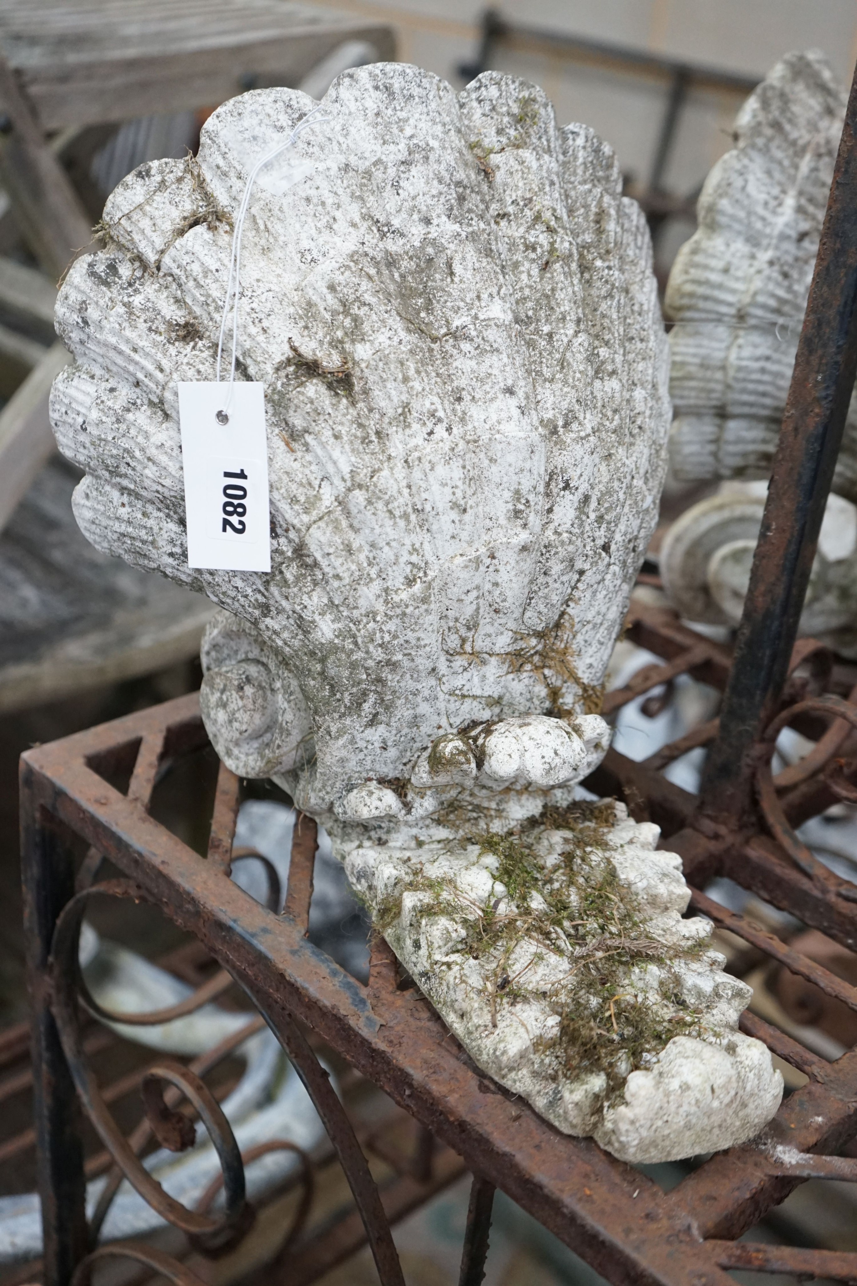 A pair of reconstituted stone scallop shell garden wall pockets, width 29cm, depth 30cm, height approx. 32cm